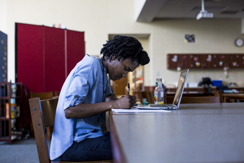 Fellows working at laptop.